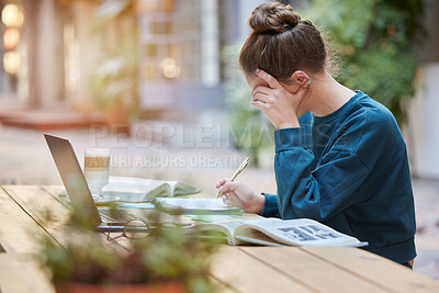 Buy stock photo Woman, student and writing in study for elearning, education or working with laptop and books at an outdoor coffee shop. Focused female studying remote with notebook for assignment at outdoor cafe