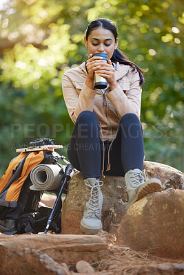 Buy stock photo Sports, hiking and woman with coffee in forest to relax from walking, trekking and exercise in morning. Nature, fitness and happy girl drinking coffee on rocks for freedom, adventure and wellness