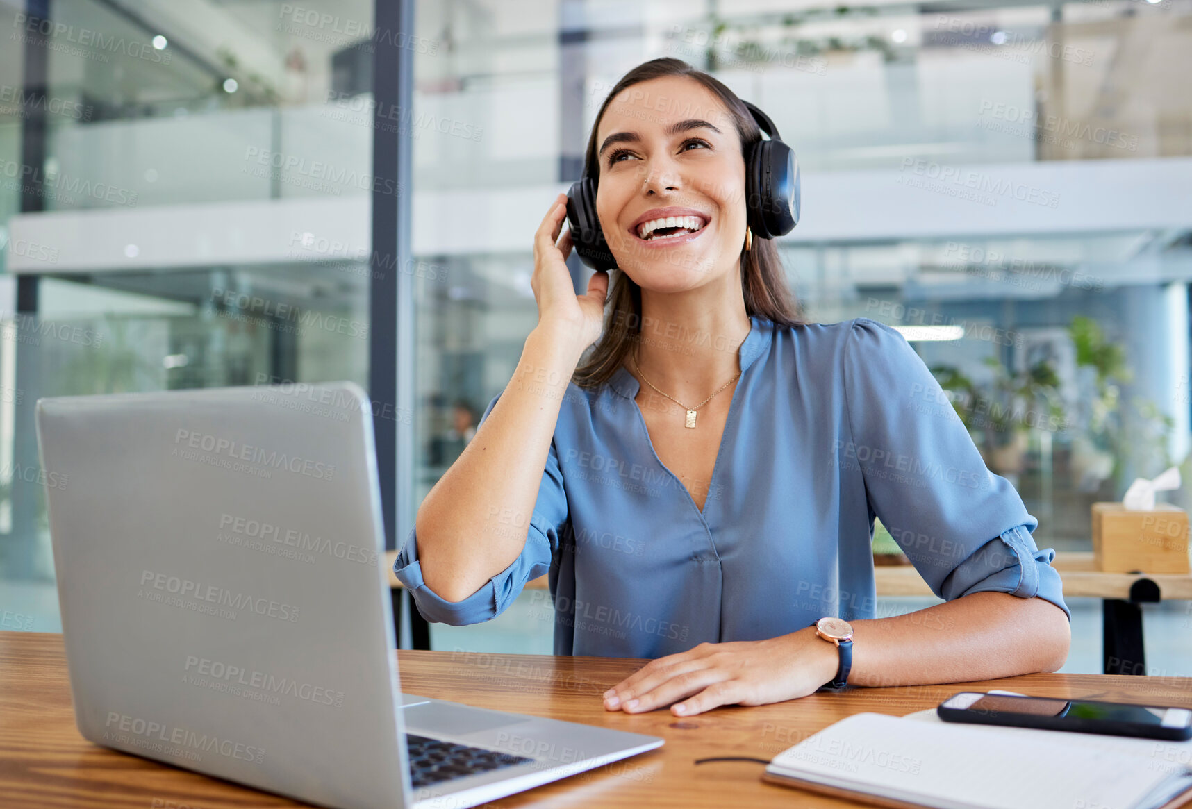 Buy stock photo Music, headphones and business woman in office streaming radio or podcast. Break, thinking and happy female employee from Canada on desk with laptop listening to song, audio or sound at workplace.