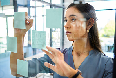 Buy stock photo Corporate woman, sticky notes and glass board for planning, brainstorming and strategy at modern office. Marketing expert, thinking and idea for innovation, writing and vision at office in Barcelona
