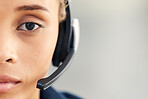 Closeup, face or woman in call center, crm professional or customer service with focus, vision or headset. Communication expert, customer support worker or contact us at office in zoom of microphone