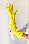 Cleaning gloves, hands and woman in home ready to sanitize for hygiene, wellness and health. Spring cleaning, cleaning service and female cleaner preparing to remove dust, germs or bacteria in house