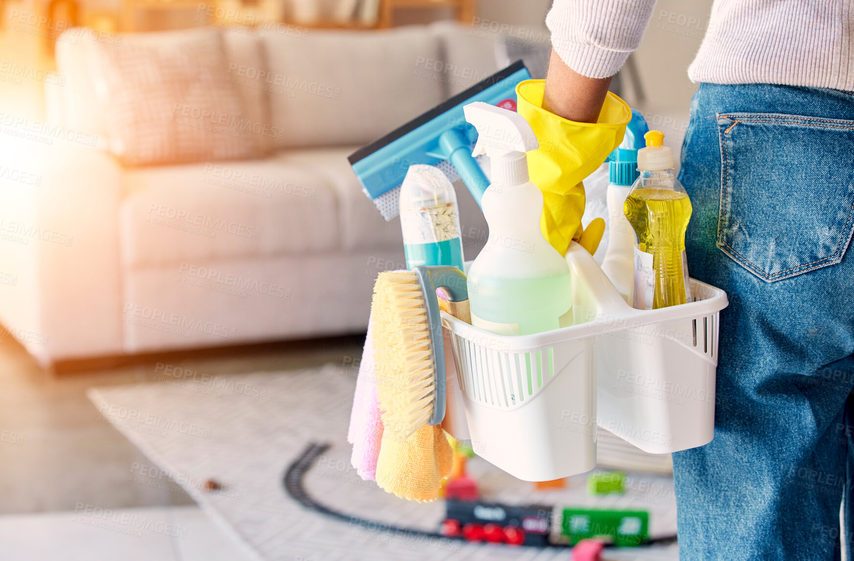 Buy stock photo Cleaning, hand and basket of cleaning supplies for family home hygiene with a brush, bottles and gloves. Woman, cleaning supplies and housekeeper about to clean a home for spring cleaning