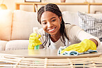 Smile, spray bottle and black woman cleaning table with gloves and alcohol solution in living room. Coffee table, spring cleaning and happy woman wiping dust in home for safety from bacteria and germ