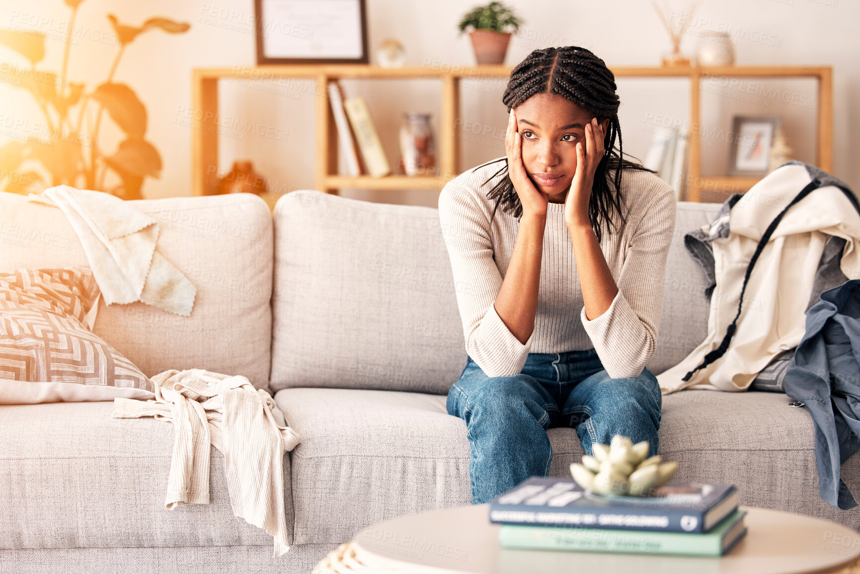 Buy stock photo Sad, thinking and black woman with depression on sofa in home. Mental health, anxiety and female from Nigeria on couch contemplating rent, student loans or life problems, mistake or stress in house.