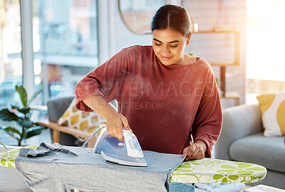 Buy stock photo Laundry, cleaning and woman iron clothes on ironing board for fresh, neat and tidy clothing. Cleaning service, domestic work and happy girl ironing t shirt for housekeeping, maid and housewife chores