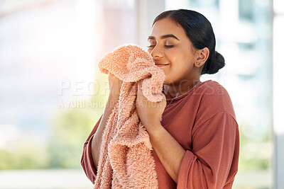 Buy stock photo Woman smelling clean laundry, blanket or fabric for fresh and clean smell in house after doing washing, cleaning and housekeeping. Happy female cleaner with textile for aroma, fragrance and scent