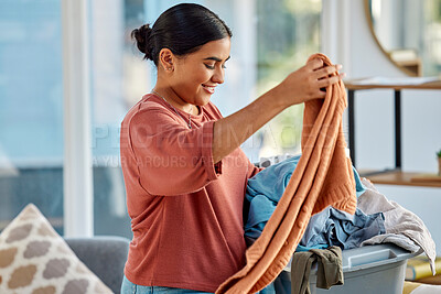 Buy stock photo Cleaning, laundry basket and woman with clothes in home getting ready to wash clothing. Spring cleaning, hygiene and happy female preparing for fabric washing, housework or chores in living room.