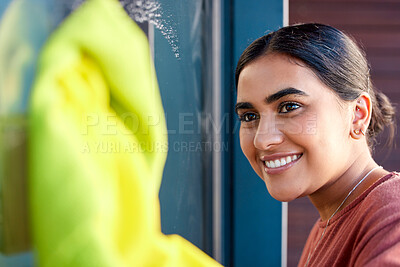 Buy stock photo Woman, cleaning and window washing with a smile to clean windows dirt with water, soap and fabric. Happy Indian person cleaner or maid doing spring cleaning with happiness for housekeeping helping