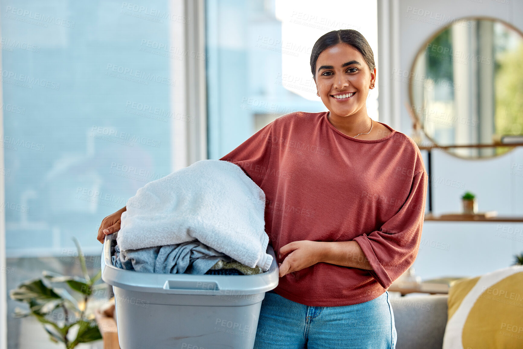 Buy stock photo Woman, laundry and portrait smile for clean clothes, personal hygiene or housework at home. Happy female holding washing basket of material for cleaning, chores or housekeeping in the living room