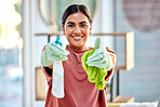 Woman, portrait smile and detergent with cloth for cleaning, hygiene or house disinfection at home. Happy female cleaner  smiling holding spray bottle and fabric for disinfect, wash or housework