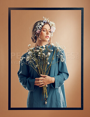 Flowers, woman and fashion in frame on studio background for abstract beauty, floral aesthetic and natural style. Model with spring plants, flower bouquet and creative cosmetics, eco makeup or peace