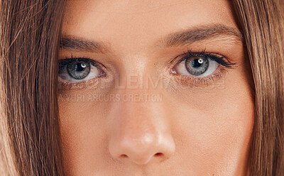 Woman, eyes and face in vision for sight, beauty or awareness staring with facial cosmetics or makeup. Closeup portrait of female looking in eyesight, skincare or microblading eyebrows and eyelashes