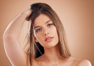 Buy stock photo Beauty, face and hair care of a woman on studio background for skincare, cosmetics and shampoo product for growth and shine. Portrait of aesthetic model with makeup for salon and hairdresser ads