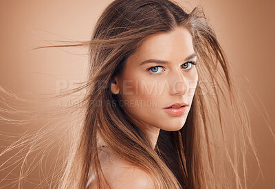 Buy stock photo Woman, cosmetics and skincare for beauty, hygiene and treatment against brown studio background. Female, girl and headshot for scalp massage, wavy and glow for wellness, portrait and head grooming.