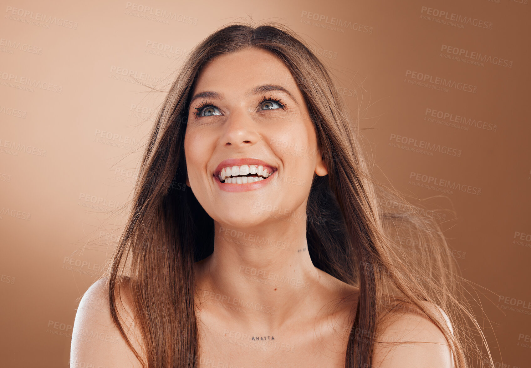 Buy stock photo Hair, beauty and face of woman with smile on brown background for wellness, skincare and luxury spa. Cosmetics, health and happy girl with blowing hairstyle for beauty salon, treatment and hair care