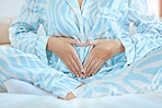 Woman, heart hands or pregnant tummy in bedroom of house, home or nursery hospital in family planning, love or baby trust. Mother, pregnancy announcement or parent touching belly for children growth