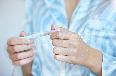 Buy stock photo Pregnancy, test and hands of woman with results for future family, children and baby in bathroom. Healthcare, motherhood and closeup of girl holding home pregnant kit testing for fertility wellness