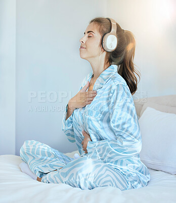 Buy stock photo Woman, morning and headphones for meditation on bed while listening to music or podcast while breathing for chakra exercise in bedroom. Female at home with pajamas with audio for mental health