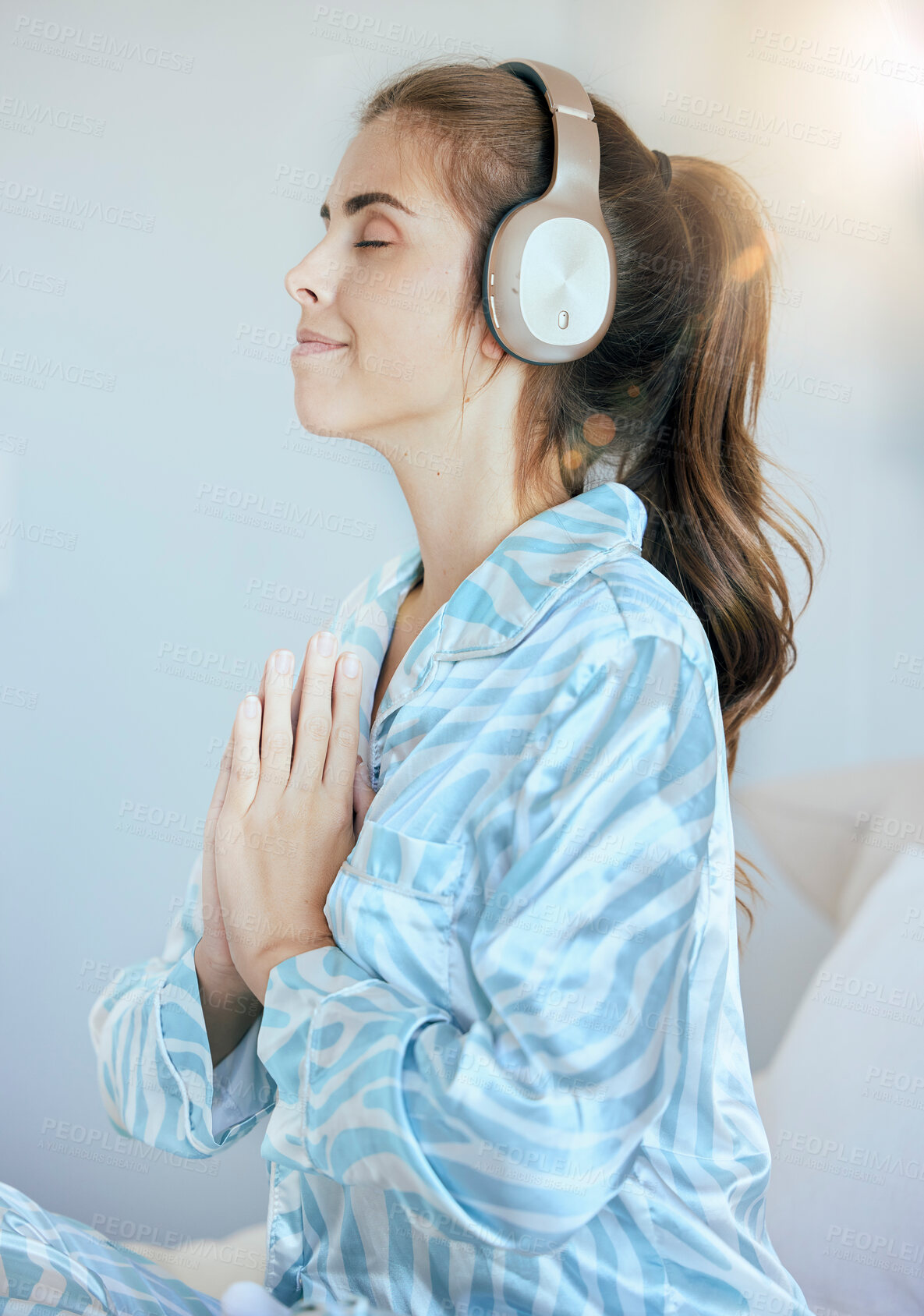 Buy stock photo Headphones, prayer or woman in meditation in bedroom streaming relaxing zen music, yoga podcast or radio at home. Morning, peace or calm spiritual girl praying for mindfulness, health or wellness 