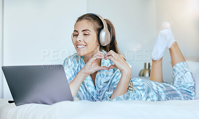 Buy stock photo Woman, video call and heart hand sign of a person in the morning with headphones on a computer. Bedroom bed, smile and happiness of a female in a home feeling happy and relax on digital communication