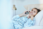 Phone call, bedroom and woman talking in home in the morning after waking up. Smile, mobile and happy female in bed smiling while speaking, discussion or chatting with contact on smartphone in house.