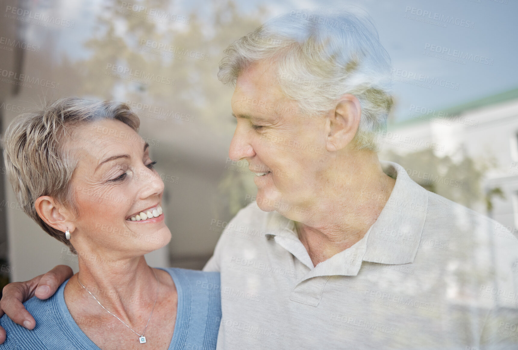 Buy stock photo Love, hug and window with senior couple, smile and retirement for bonding, romance and relationship. Romantic, man and woman embrace, marriage and happiness for intimate quality time and glass.