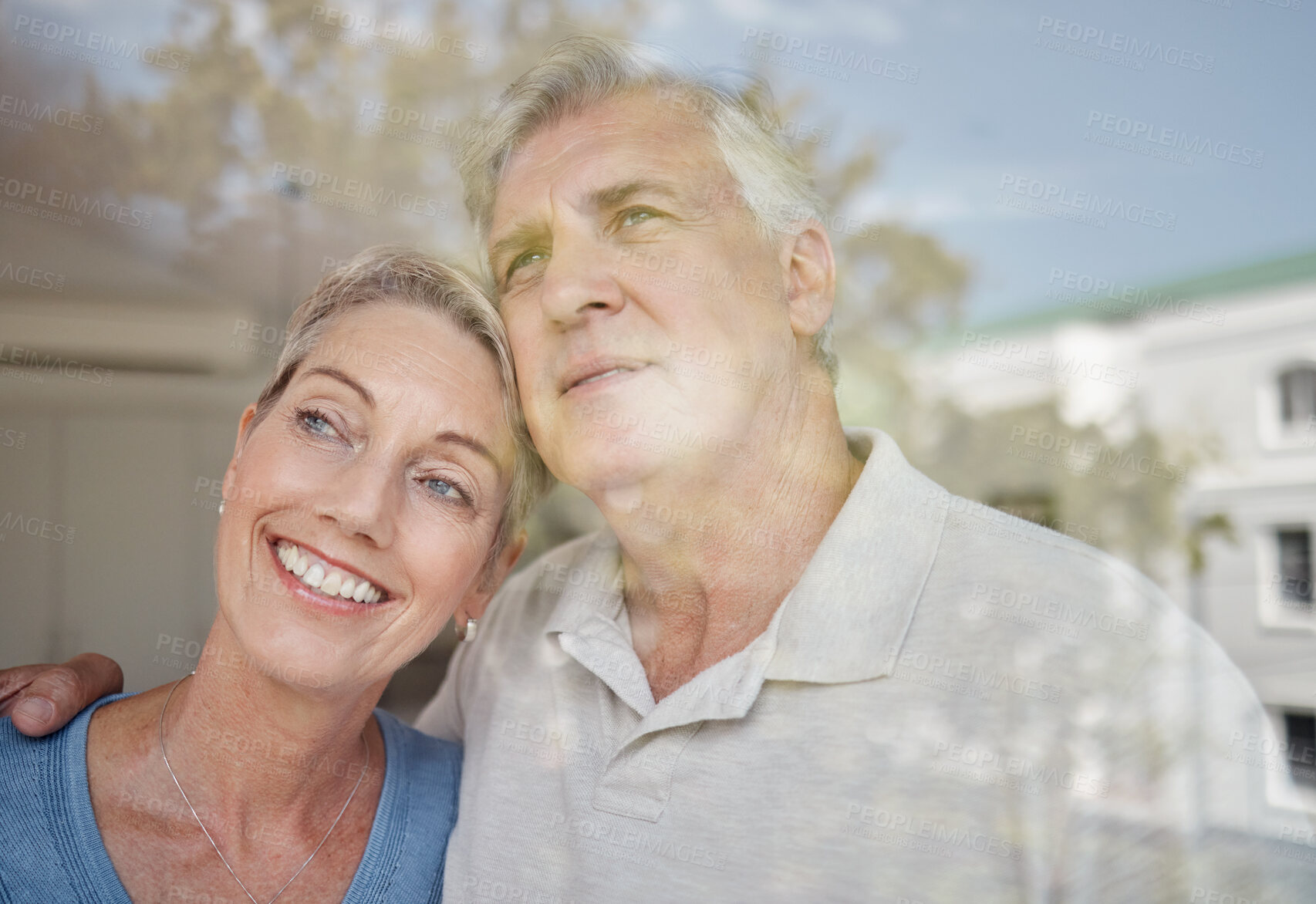 Buy stock photo Hug, thinking and senior couple at a window with vision of future, retirement peace and relax in their home. Idea, love and elderly man and woman with affection in their apartment looking from glass