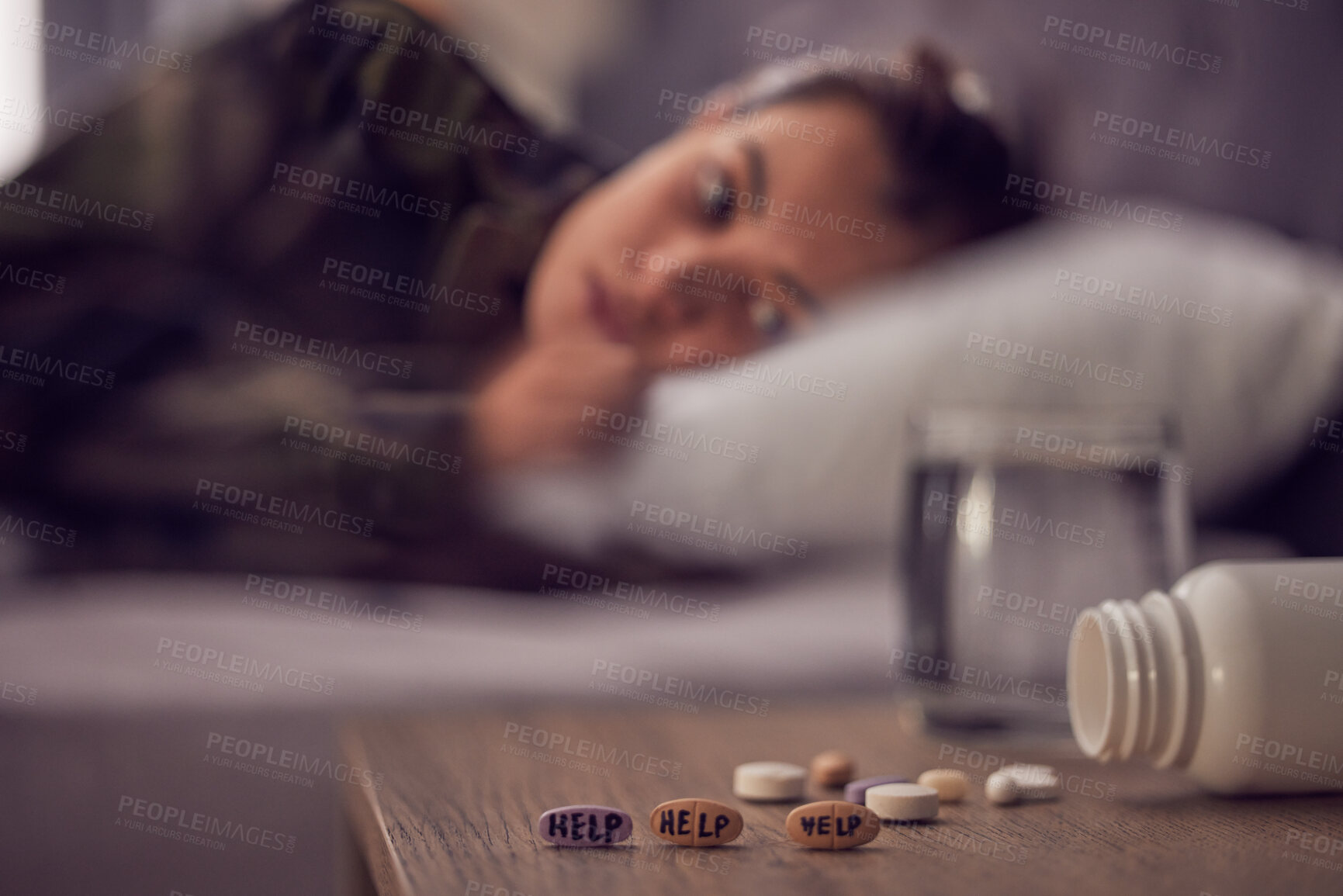 Buy stock photo Depression, anxiety and medicine with a suicide woman lying on her bed in the bedroom of her home alone. Mental health, help and pills with a female suffering from a psychology disorder in her home