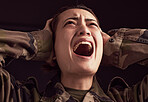 PTSD, crying and trauma with a woman soldier shouting or screaming in studio on a dark background. Scream, grief and tears with a young army female suffering from military memories of war or pain