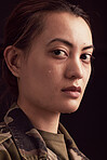 Crying, war soldier and face of sad woman with depression, military ptsd and trauma from army service on studio black background. Portrait of depressed young female veteran with tears from battle 