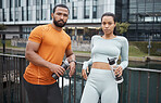 Portrait, fitness or black couple in city for workout, relax after workout or with water bottle for drinking. Partner, wellness or black woman and man for sports, training or running break in Canada