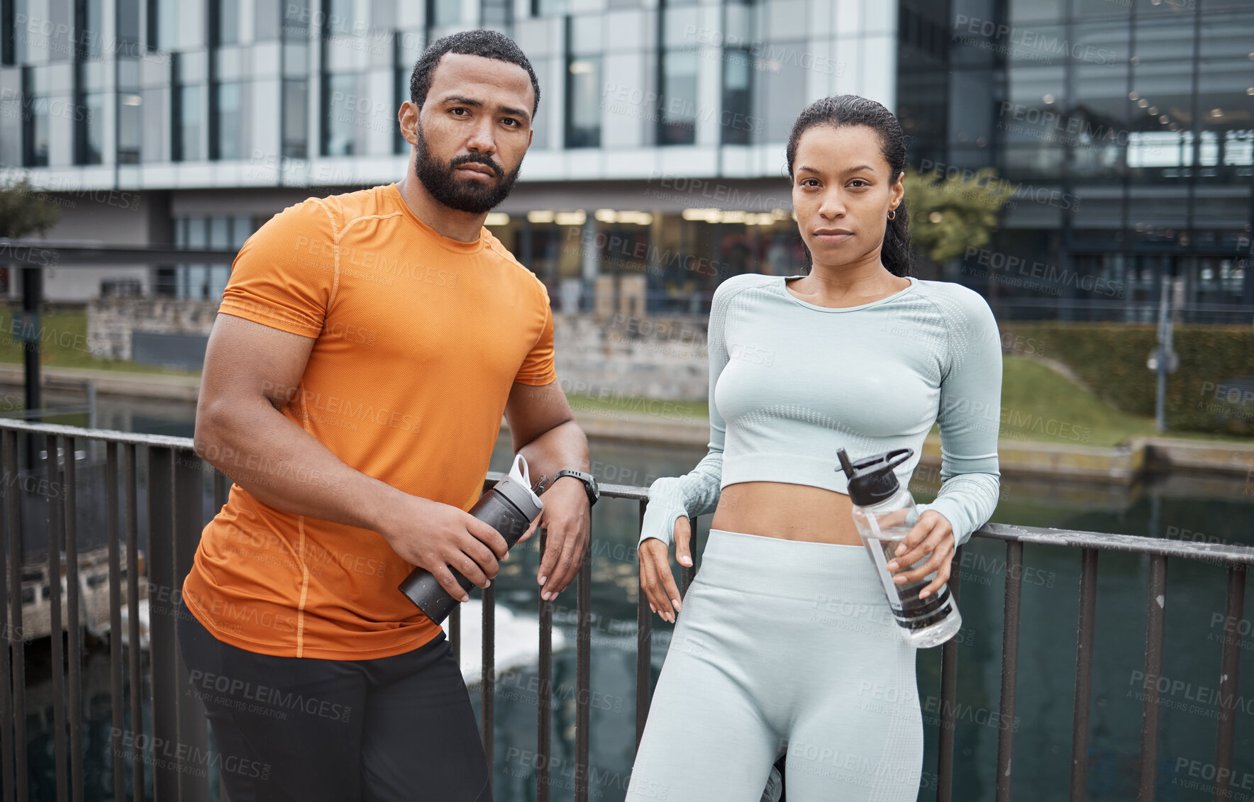 Buy stock photo Portrait, fitness or black couple in city for workout, relax after workout or with water bottle for drinking. Partner, wellness or black woman and man for sports, training or running break in Canada