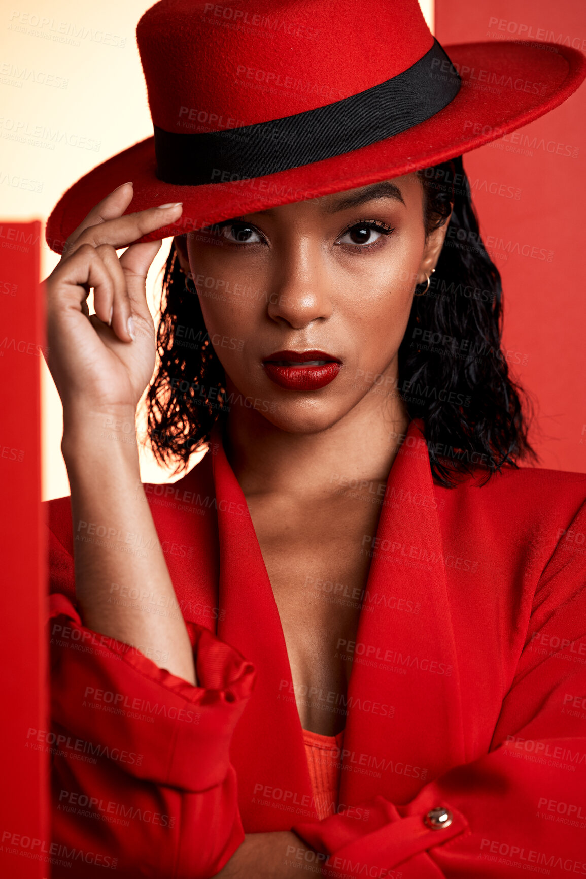 Buy stock photo Face, fashion and black woman in red hat, suit and stylish clothing. Portrait, beauty and aesthetic of female model from South Africa posing with makeup, cosmetics or edgy, classy and designer outfit