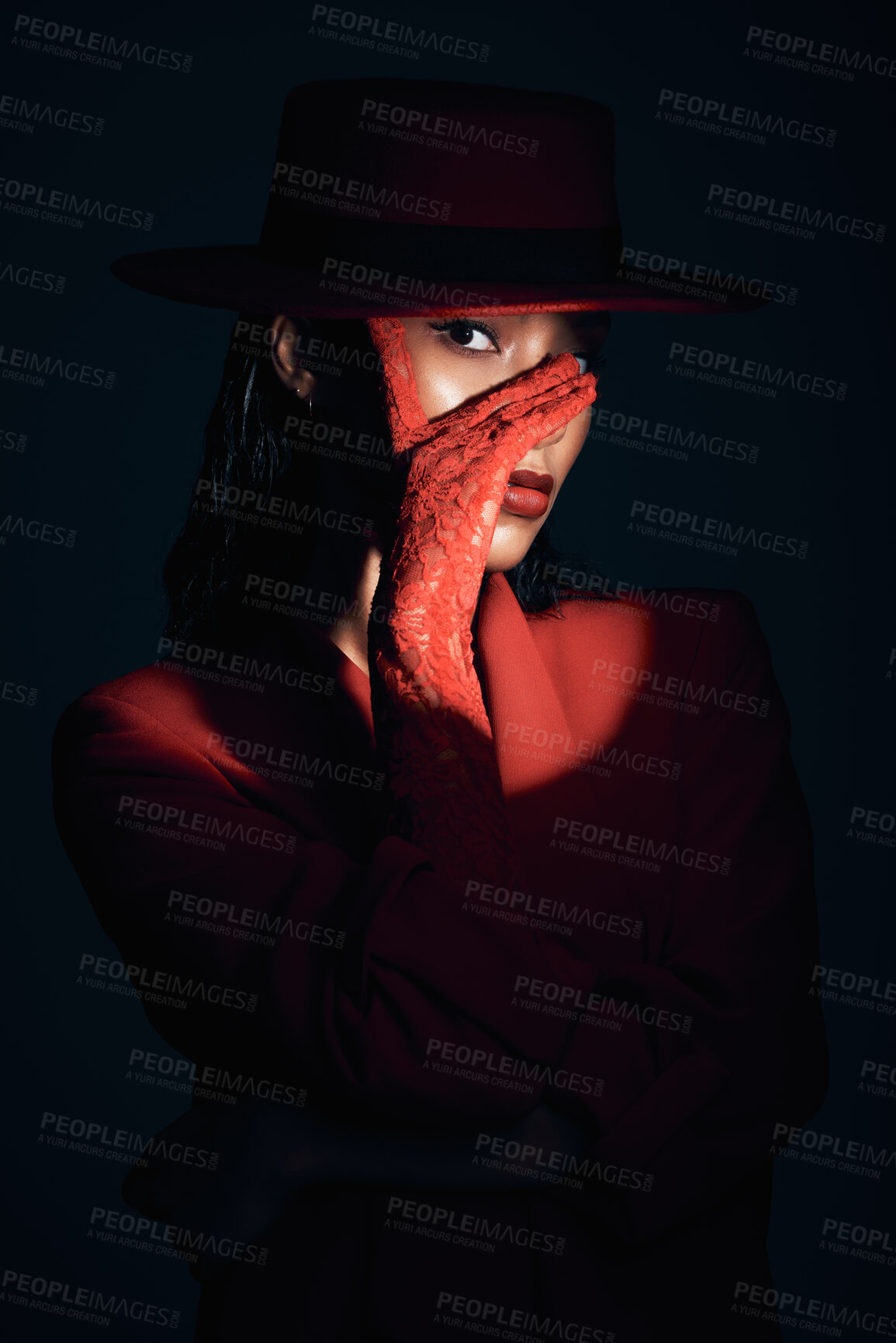 Buy stock photo Beauty, fashion and aesthetic woman in dark studio with spotlight on eye, face or head for makeup, cosmetics and show girl portrait. Female model with lace gloves and red clothes for retro 90s style