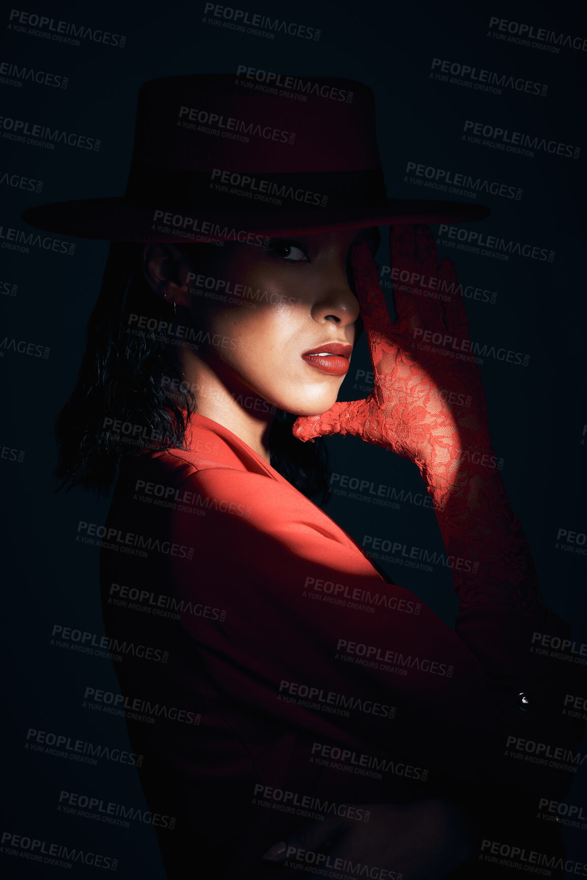 Buy stock photo Dark, woman and spotlight with a model black woman in studio on a black background for fashion. Mystery, shadow and style with an attractive young female posing at an art event or creative showcase