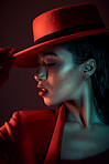 Dark, sexy and black woman profile, fashion and red aesthetic, cool with edgy and retro style with studio background. Sensual, seductive and skin with beauty, vintage and designer hat with mystery.