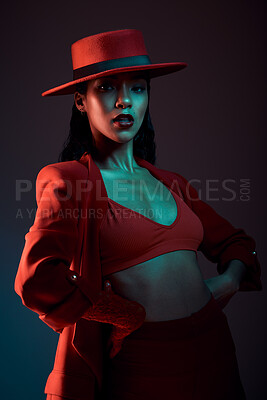 Buy stock photo Fashion, red aesthetic and woman in dark studio with neon background in trendy, stylish and cool outfit. Beauty, creative style and portrait of female model with luxury, designer and retro clothes