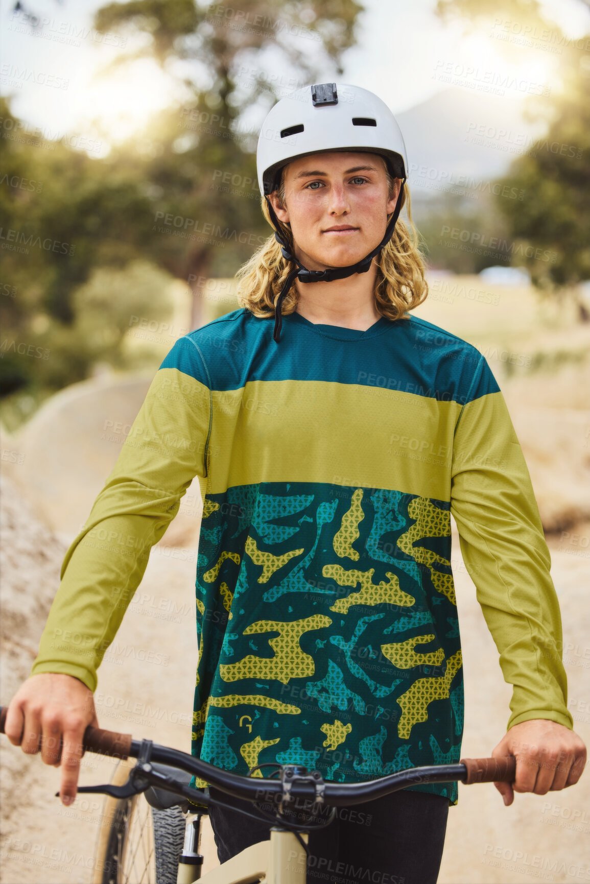 Buy stock photo Mountain bike, portrait and man in nature or park for outdoor training, sports competition or fitness goals in Canada with youth lifestyle. Athlete cycling with bicycle and safety helmet for exercise
