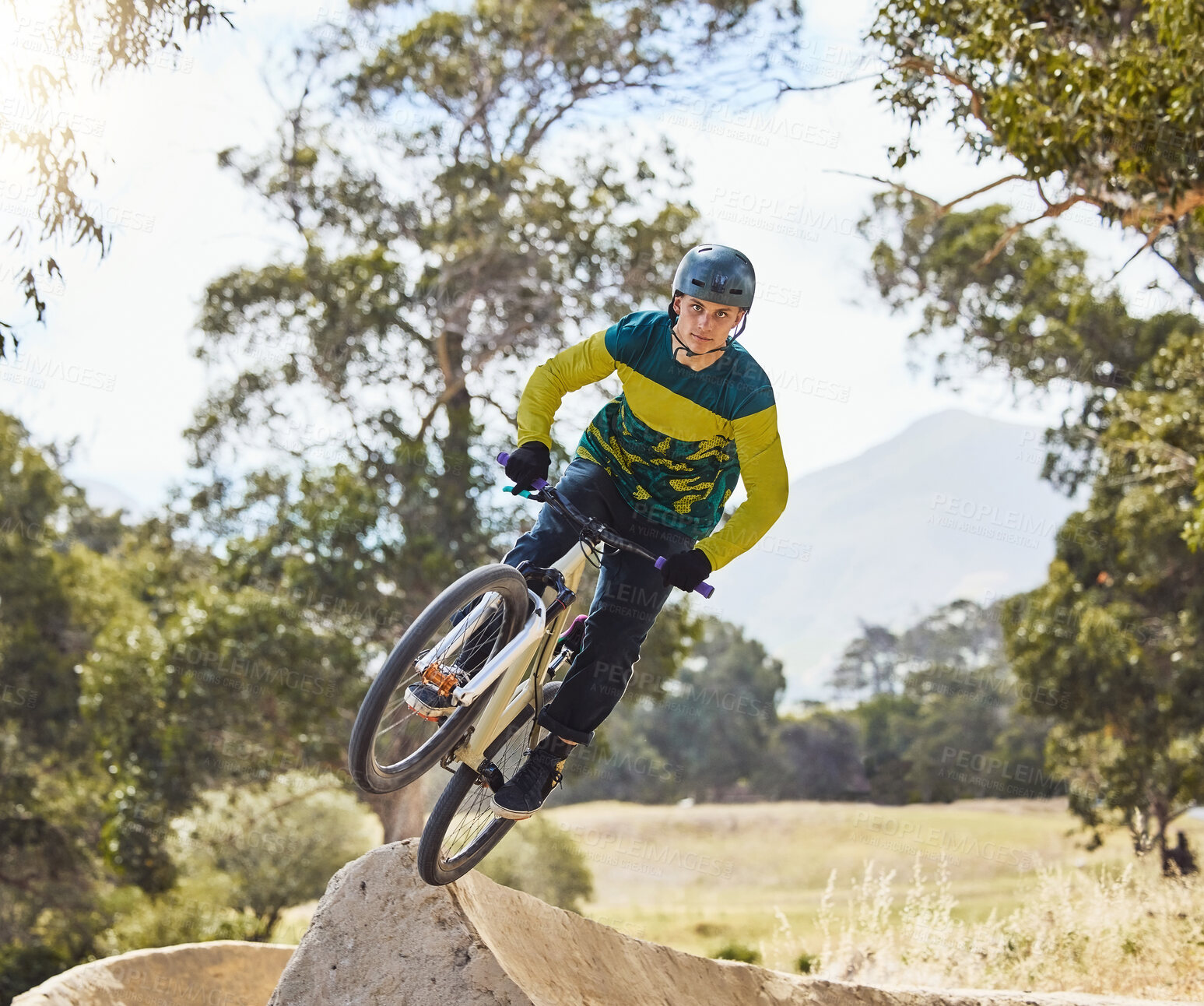 Buy stock photo Mountain bike man, air ramp and outdoor with helmet, extreme sport and focus for fitness, speed and training. Bmx bicycle. sports expert and fast jump in nature, trail and cycling for competition