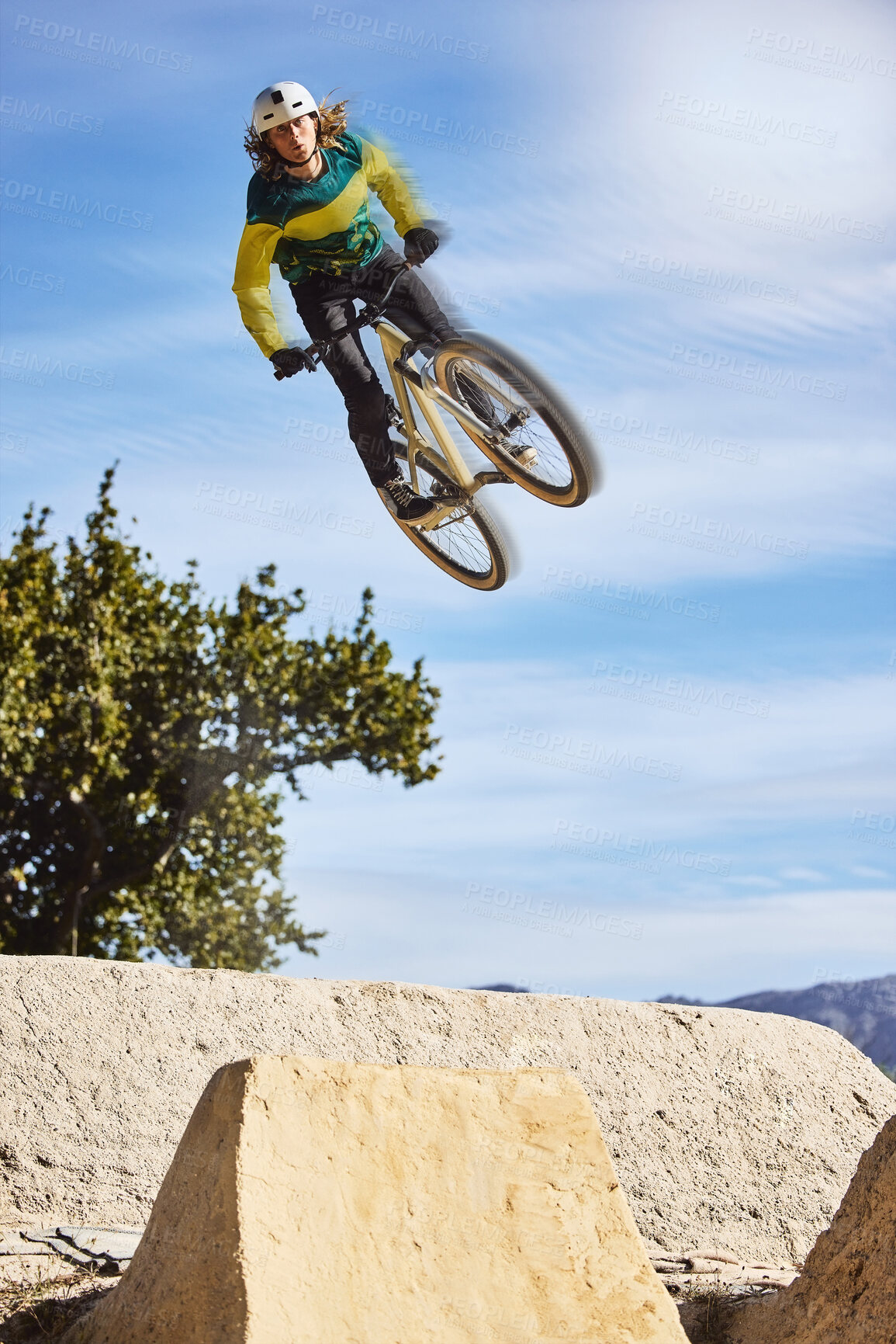 Buy stock photo Sports, mountain bike and jump in sky with man cycling for nature exercise, workout and training for competition. Athlete flying in air with bicycle for extreme transport travel or freedom at park