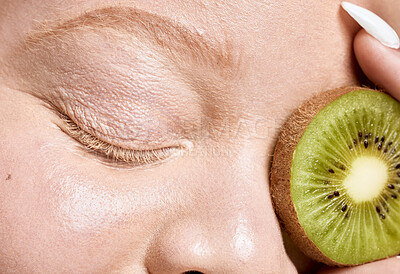 Buy stock photo Woman, face and kiwi for eyes skincare glow or cosmetics dermatology and salon spa beauty wellness. Natural fruit detox, cosmetology nutrition and model facial care, luxury vitamin c and self care