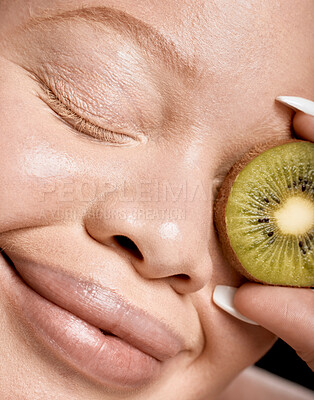 Buy stock photo Face, kiwi and cosmetics for woman, wellness, health and skincare for beauty, clear and smooth skin. Makeup, fruit and organic facial for natural detox, healthy lifestyle and nutrition for treatment 