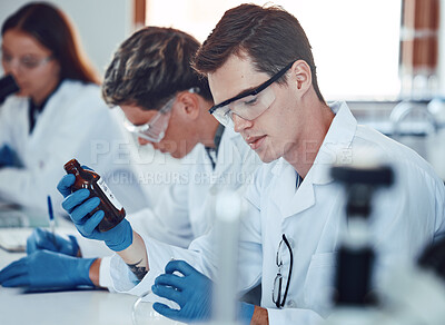 Buy stock photo Science, pharmaceutical and student working with chemistry drugs for a pharmacy experiment. Medical laboratory, scientist and clinic research in a university, college and education lab for study