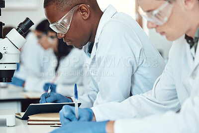 Buy stock photo Science students, research and writing in laboratory, experiment and healthcare innovation. Researchers, notebooks and make notes for medical scientific methods, exams and analysis for cure and focus