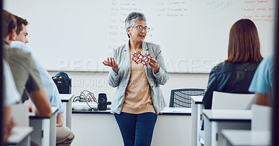 Buy stock photo Education, university professor and students in classroom for lecture on innovation in science, physics or math. Focus, attention and woman college teacher in presentation with diversity in learning.