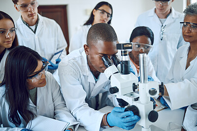 Buy stock photo Teamwork, collaboration and group of scientists with microscope for experiment. Science, laboratory and team of people or doctors with books and equipment for medical research, analysis and testing.