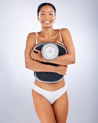 https://photos.peopleimages.com/picture/202212/2571412-portrait-black-woman-and-scale-for-diet-weight-loss-and-smile-for-healthy-lifestyle-wellness-and-relax-on-grey-studio-background.-african-american-female-weigh-and-health-for-body-care-or-balance-fit_400_400.jpg