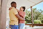 Relax, love and black couple on patio in home enjoying summer holiday, vacation and free time on weekend. Garden, affection and happy man and woman hug for bonding, quality time and loving embrace