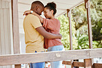 Hug, love and black couple with care, peace and praying on the porch of their house together in New Zealand. Trust, relax and African man and woman with gratitude, affection and calm at their home